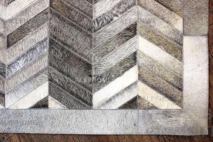 Chevron Pattern Faux Cowhide Area Rug | Non-Slip Leather Carpet for Living Room, Bedroom, and Office | Modern Designer Rug for Home Décor(6x9 ft_Grey)
