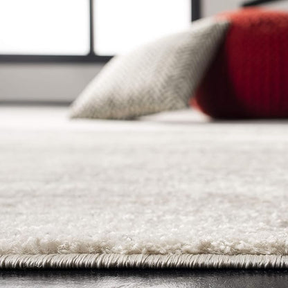 SAFAVIEH Area Rug 6x9 - Adirondack Collection - Ivory & Silver, Modern Ombre Design, Non Shedding & Easy to Clean, Ideal for Living Room, Bedroom, Office, Dining Space (ADR113B)