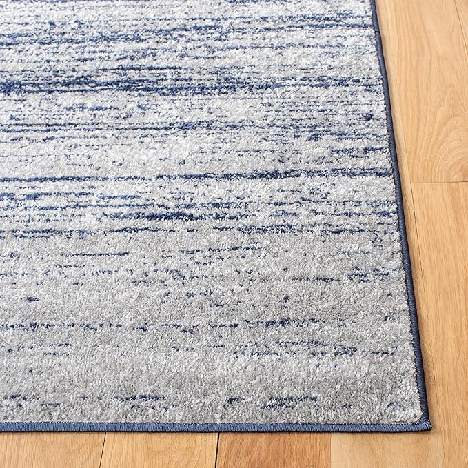 SAFAVIEH Adirondack Collection Area Rug - 5'5" x 7'7", Navy & Grey, Modern Ombre Design, Non Shedding & Easy to Clean, Ideal for Living Room, Bedroom, Office, Dining Space (ADR113E)